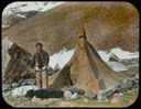 Image of Ahl-ning-wah Standing in front of Tent